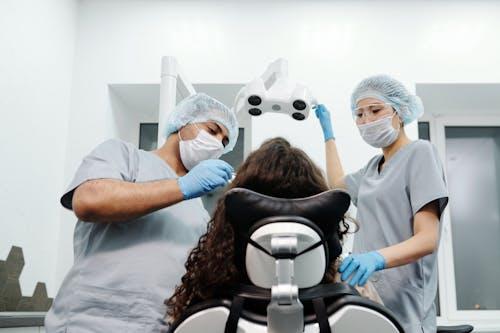 Dental clinic staff performing procedure on a patient can be a material for a short video on social media